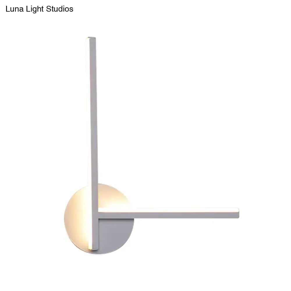 Modern minimalist linear wall light fixture with sleek white finish and geometric l-shaped design for bedroom use