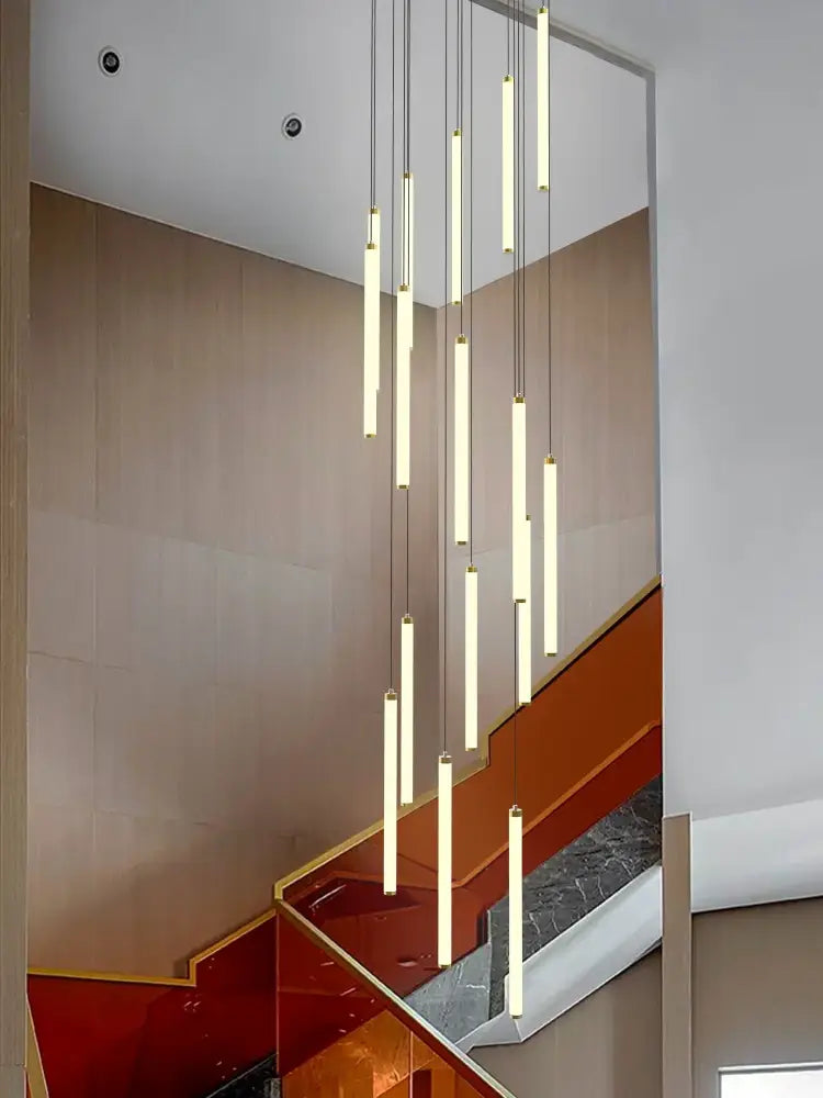 Modern minimalist loft black chandelier with slender vertical cylindrical shades emitting warm glow by decorbites loft black