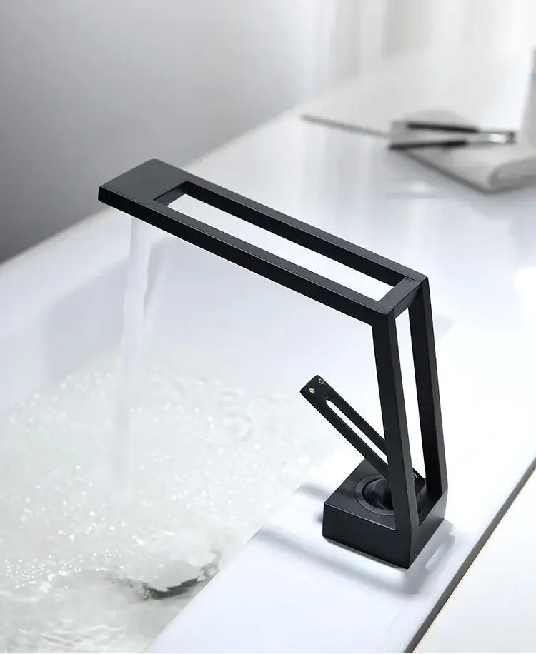 Modern minimalist matte black brass basin faucet with sleek angular design and waterfall spout by decorbites black brass basin faucet