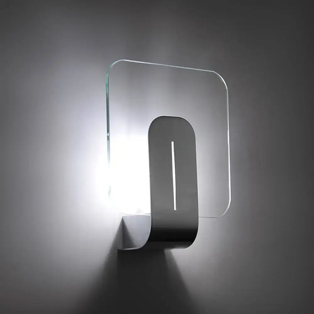 Modern minimalist nickel bathroom wall sconce with glass shade featuring a transparent panel and sleek metallic frame