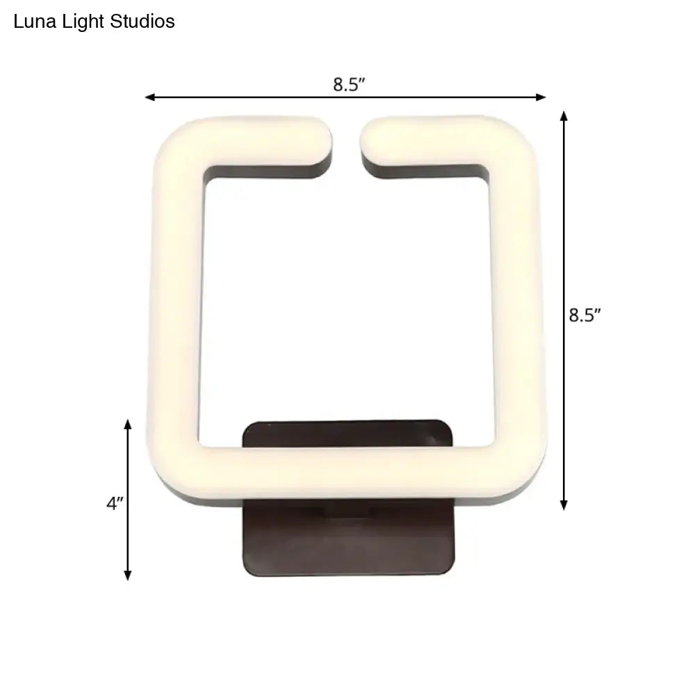 Cream-colored square led wall sconce with dark brown base providing warm white natural light for modern minimalist bedrooms