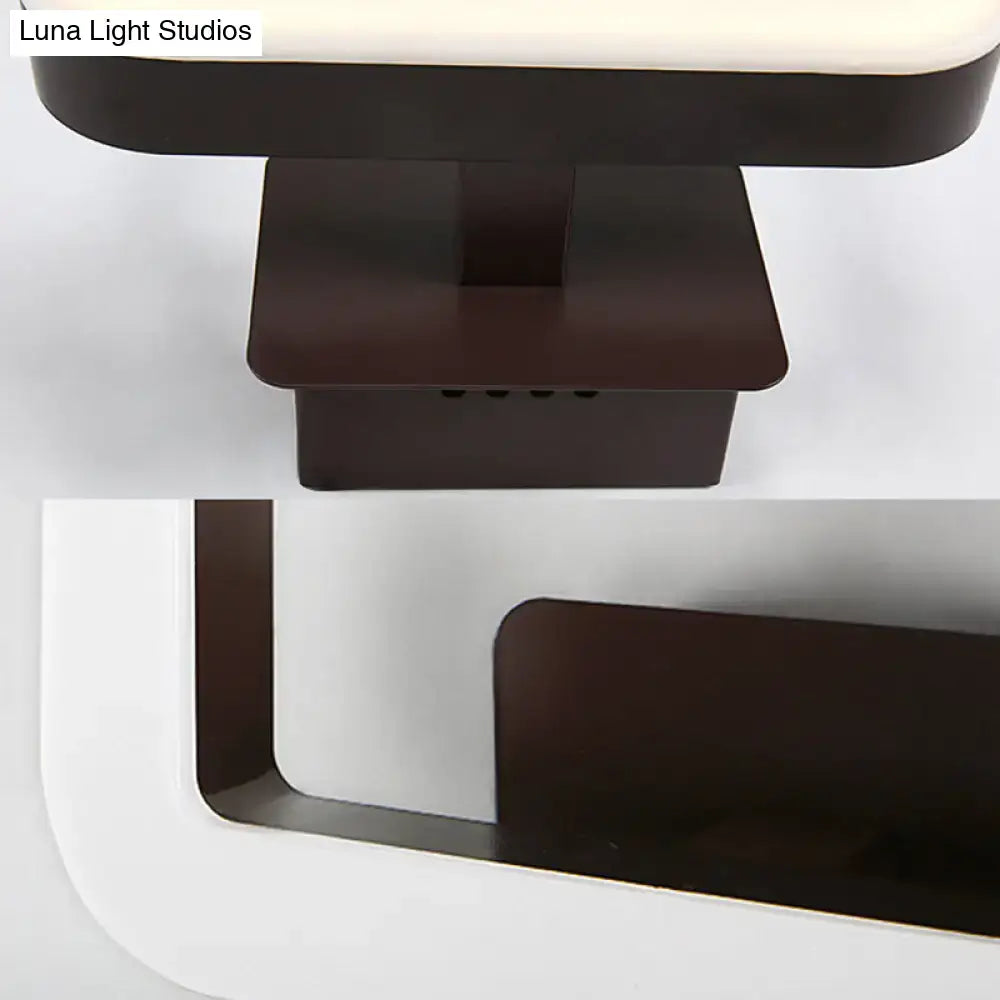 Modern minimalist off-white led wall sconce with matte black metal base and warm white natural light panel for bedroom
