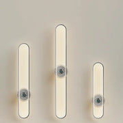 Modern minimalist silver LED strip wall light with sleek frames and warm white circular accents for living room decorbites LED strip