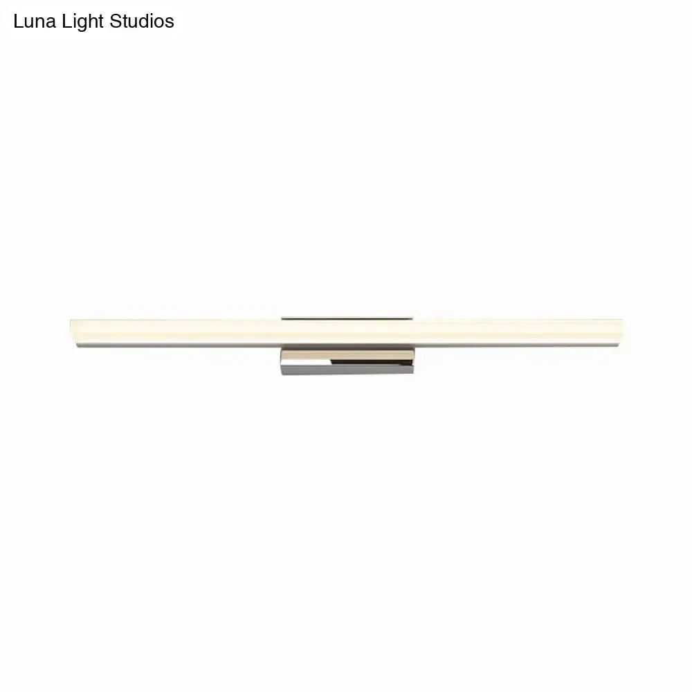 Modern minimalist silver led vanity lamp with polished chrome housing and frosted glass diffuser in a bathroom wall sconce