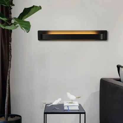 Black rectangular wall lamp with warm amber illumination modern minimalist silver linear design for living room use