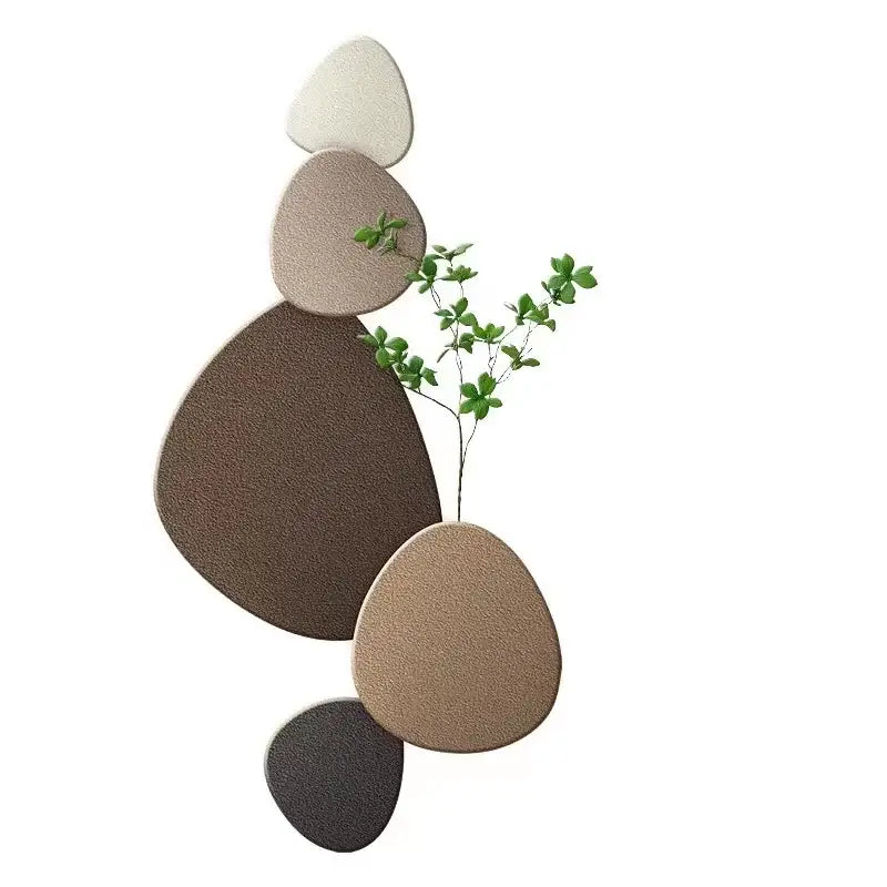 Modern minimalist wall lamp with textured stone oval plaques in earthy tones and decorbites green plant mural centerpiece