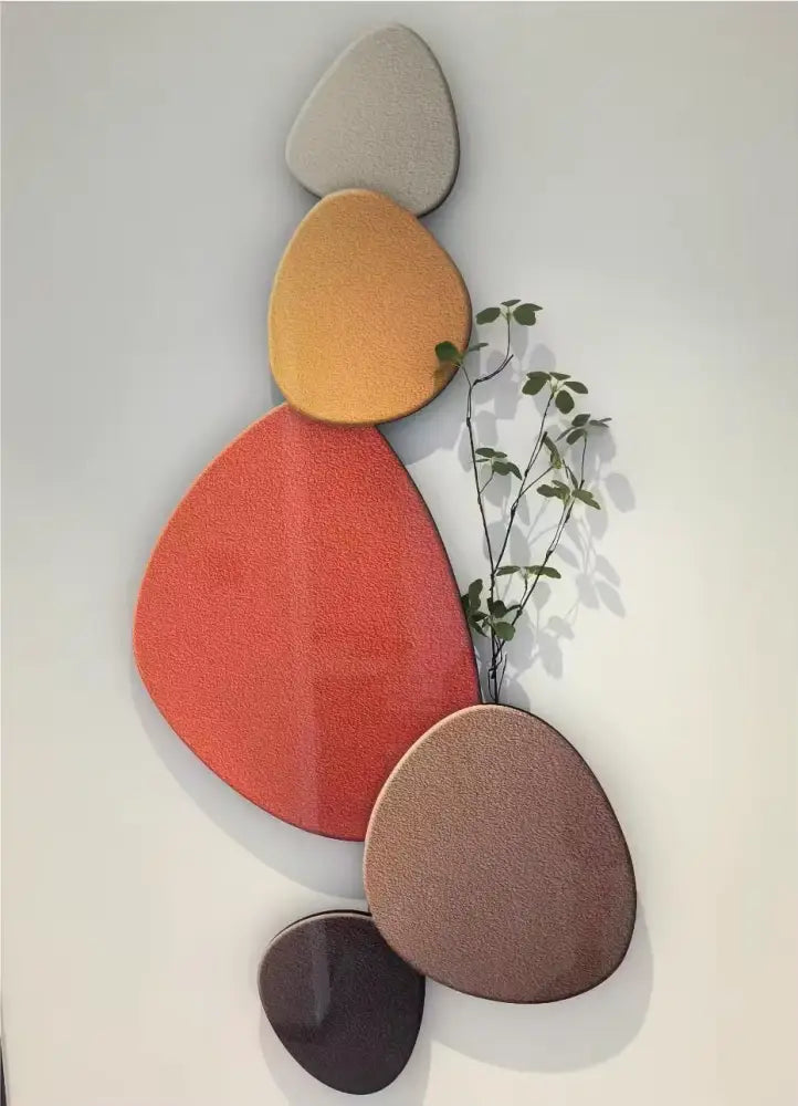 Modern abstract wall lamp with overlapping textured oval panels in earth tones decorbites green plant mural decor