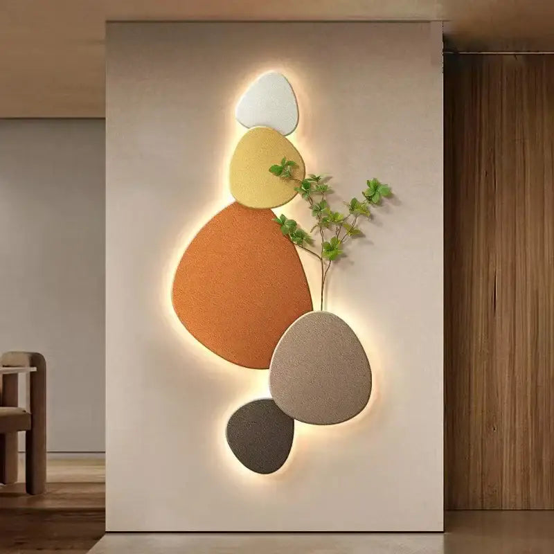 Modern minimalist textured stone wall lamp with stacked oval panels in white yellow orange beige and gray for living room decorbites green plant mural