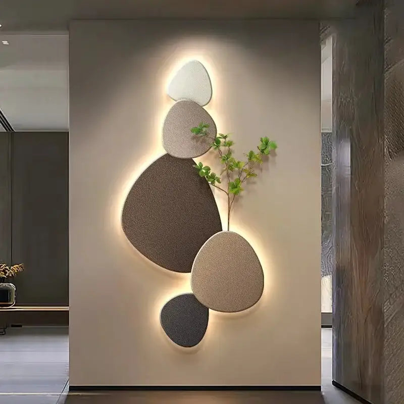 Modern minimalist wall lamp with stacked textured stone panels in beige gray and brown featuring decorbites green plant mural