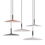 Modern minimalist ufo pendant lights with sleek matte copper white and gray disc shades suspended by black cords for dining room lighting