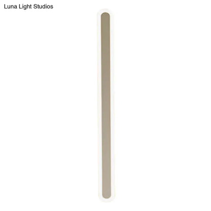 A sleek modern wall light with a minimalist slim beige rectangular body, perfect choice for bedroom light fixture