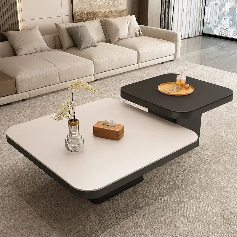 Modern minimalist white and black coffee table set featuring a sleek two-tier design with smooth surfaces and geometric edges