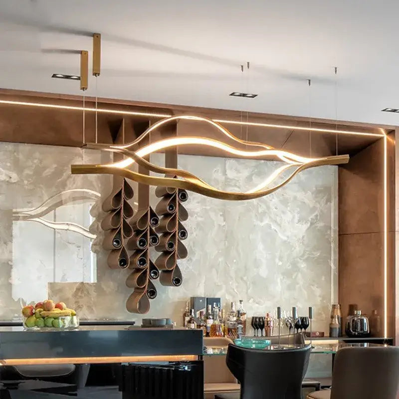 Golden sculptural decorbites lip shaped chandelier with integrated led lighting and cascading wine bottle holders for living room