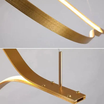 Modern gold finished metal pendant light with sleek curved design and integrated led lighting for decorbites lip shaped chandelier