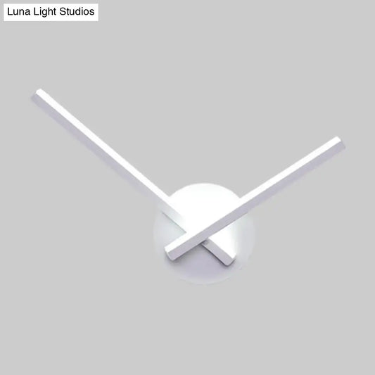 Modern minimalist white ceiling light with sleek arms and circular base featuring direct wired electric design
