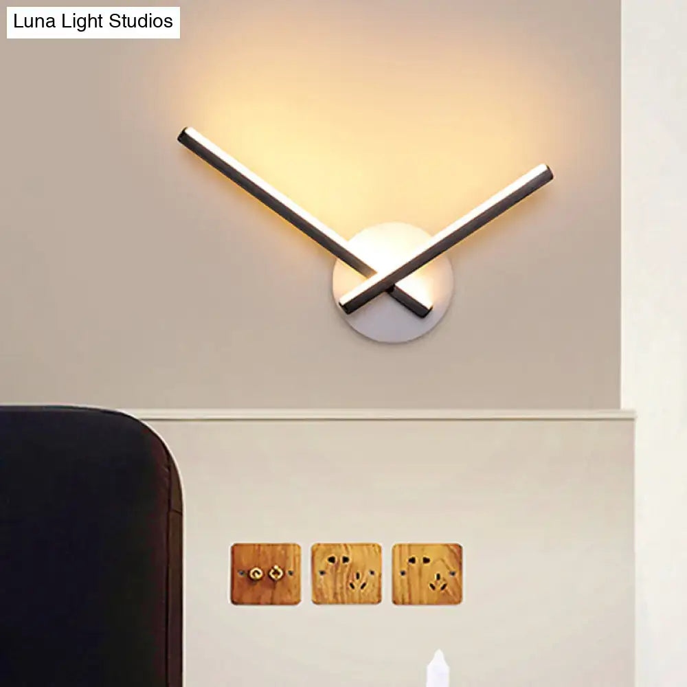 Modern minimalist white ceiling light with intersecting chrome rods and circular base, direct wired electric with maximum bulb wattage