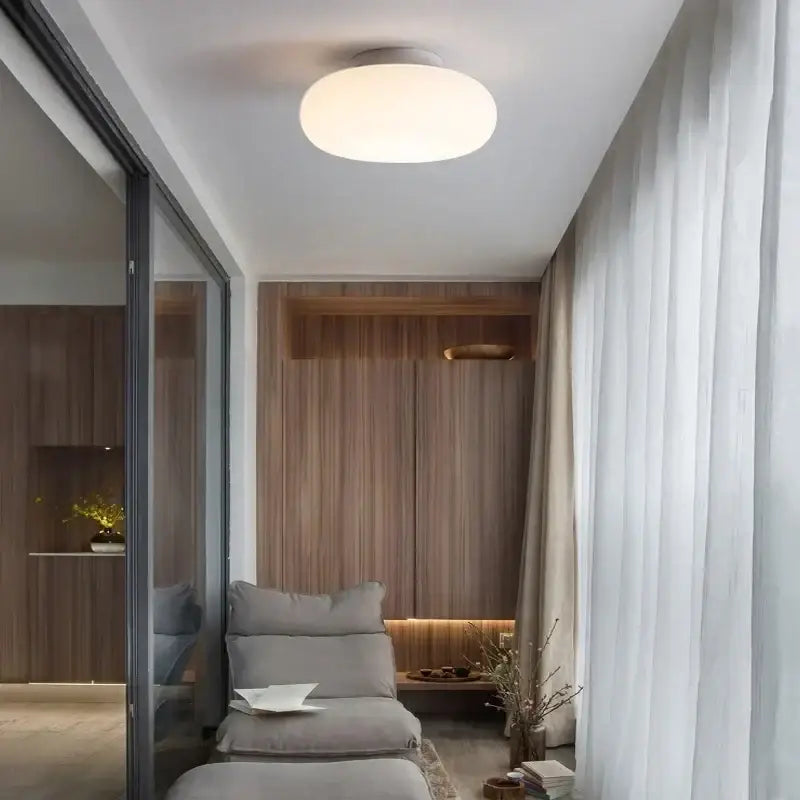 Modern minimalist white ceiling pendant lamp with soft white glow for kitchen and bedroom lighting decor