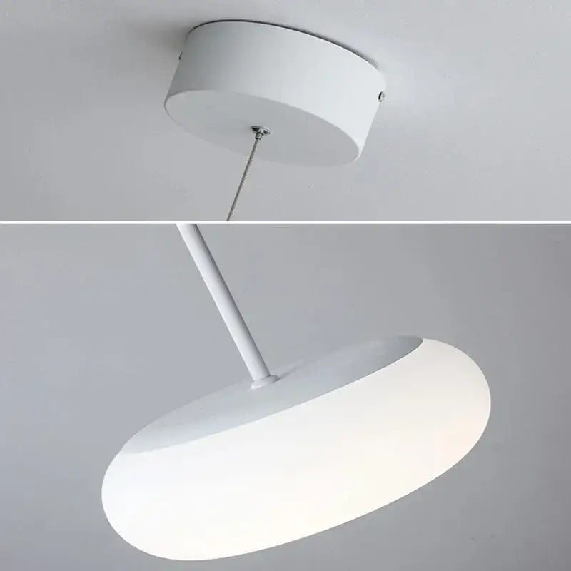 Modern white ceiling pendant lamp with oval diffuser and cylindrical mount for kitchen and bedroom lighting