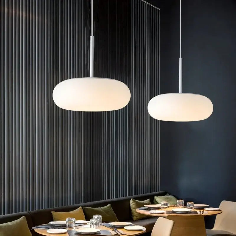 Two modern pendant lamps with frosted white oval glass shades and slender metallic rods ceiling pendant for kitchen bedroom