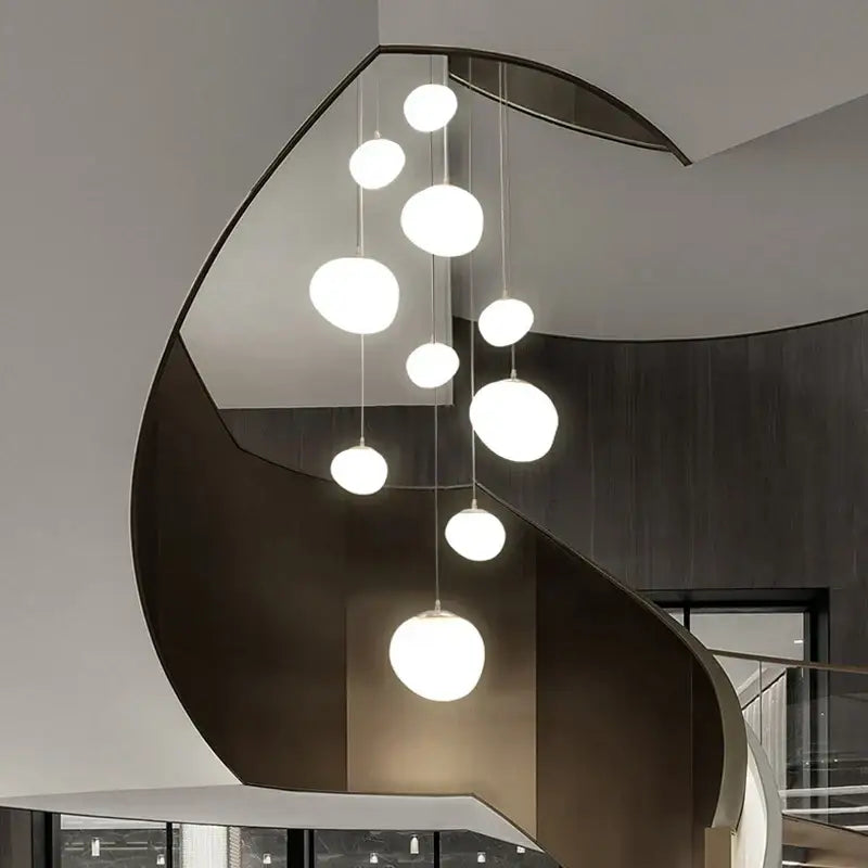 Modern white spherical pendant light with decorbites cobblestone glass led design hanging in a stairway arrangement