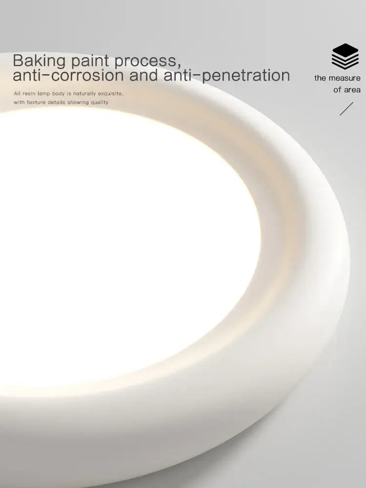 Modern minimalist white cream led ceiling lamp in resin with smooth curved design and baked-on paint finish for bedroom decorbites cream led