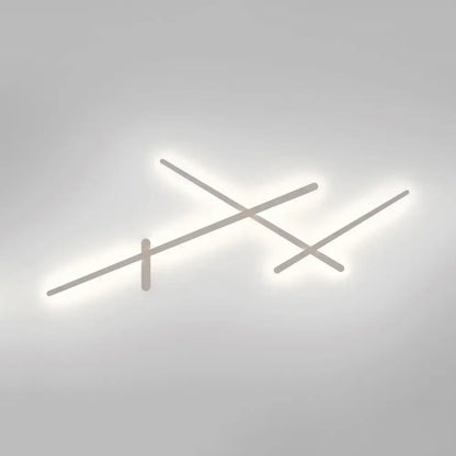 Modern minimalist white wall lamp with sleek intersecting linear arms emitting soft white LED glow for living room