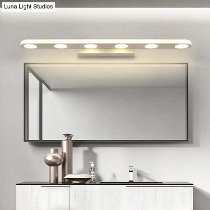 Modern rectangular bathroom mirror with sleek black frame paired with white finish acrylic shade vanity light