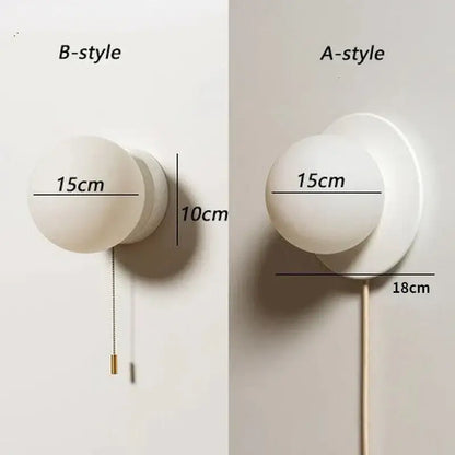Modern minimalist white frosted glass ball wall light with spherical globe and metal base available in two depths