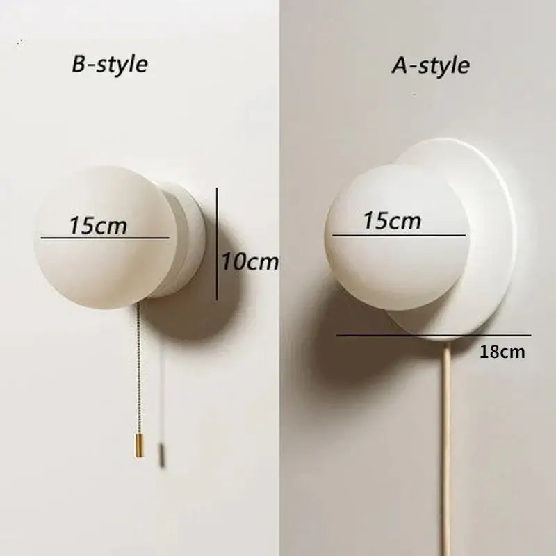 Modern minimalist white frosted glass ball wall light with spherical globe and metal base available in two depths