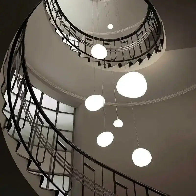 Modern minimalist white glass ball led pendant lights hang in varying sizes for stylish living room decorbites pendant lights