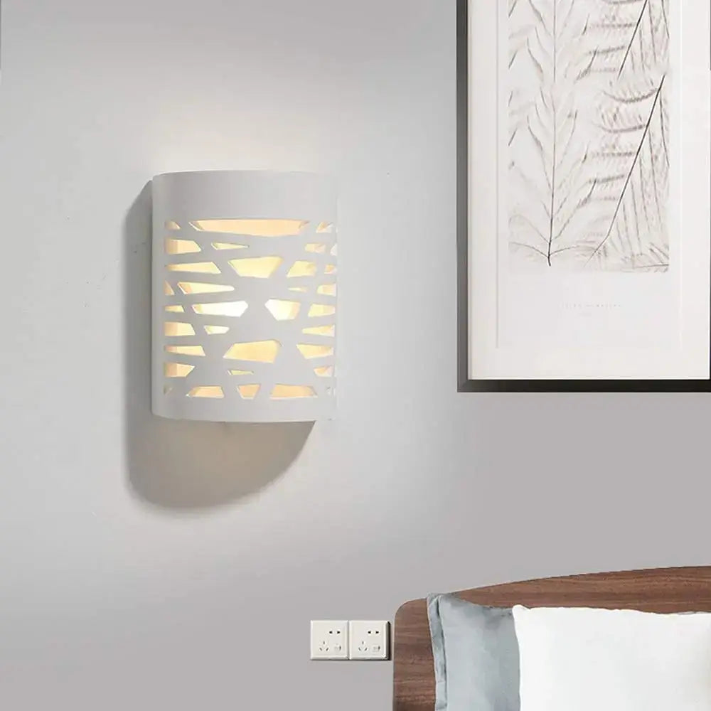 Modern minimalist white gypsum led wall lamp with geometric cutout pattern casting warm light for bedroom lighting wall lamp