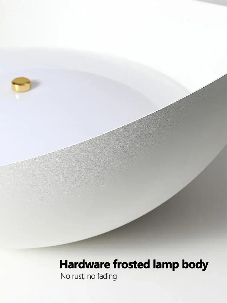 Modern minimalist white ingot ceiling lamp with frosted body and gold-toned hardware accent for bedroom lighting