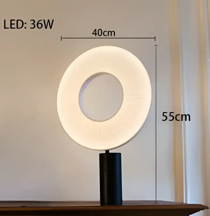 Modern minimalist white led pendant light featuring a circular ring lamp with a black cylindrical base and led source