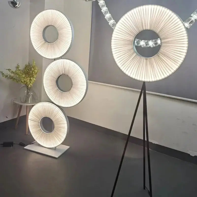 Modern minimalist white led pendant light with circular pleated fabric shade and sleek metallic frame for bedroom use