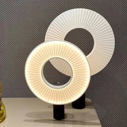 Modern minimalist white led pendant light with pleated ring lamps and illuminated inner rings on black bases