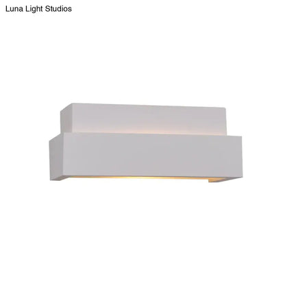 Modern minimalist white rectangular wall washer light with layered design providing warm ambient lighting for bedroom