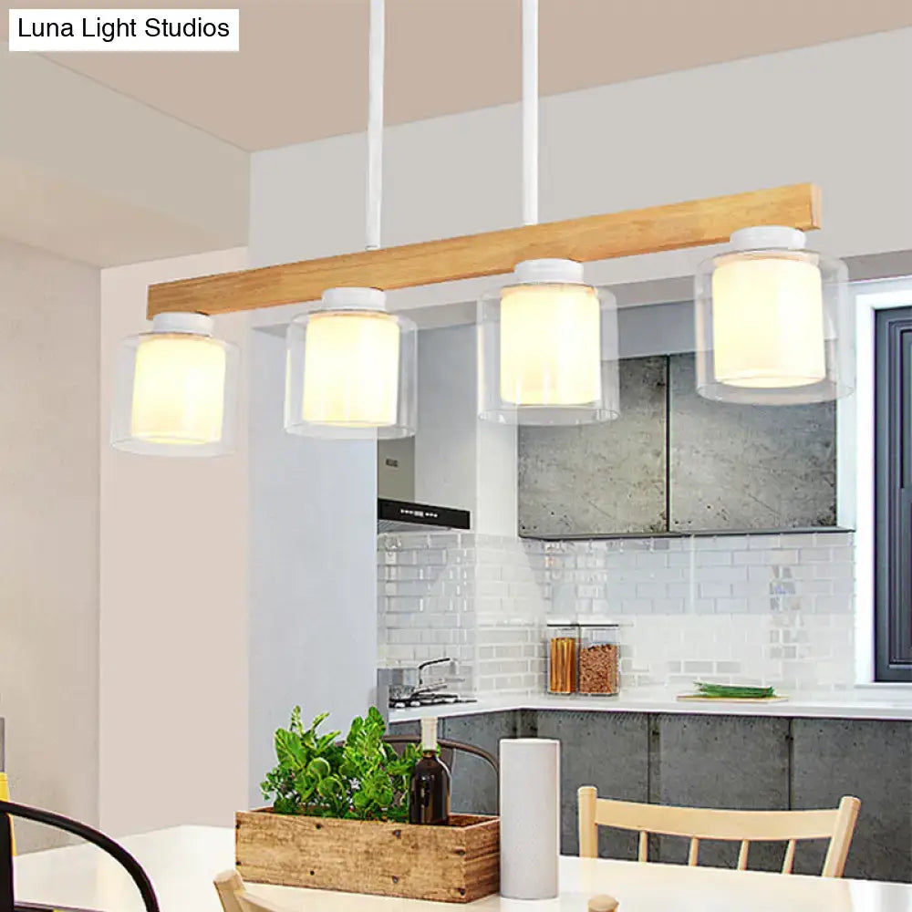 Modern farmhouse pendant light with natural wood beam and white glass shades for warm dining room illumination