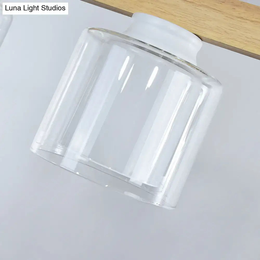 Clear glass lampshade with white plastic base for modern minimalist wood and white glass dining room pendant light