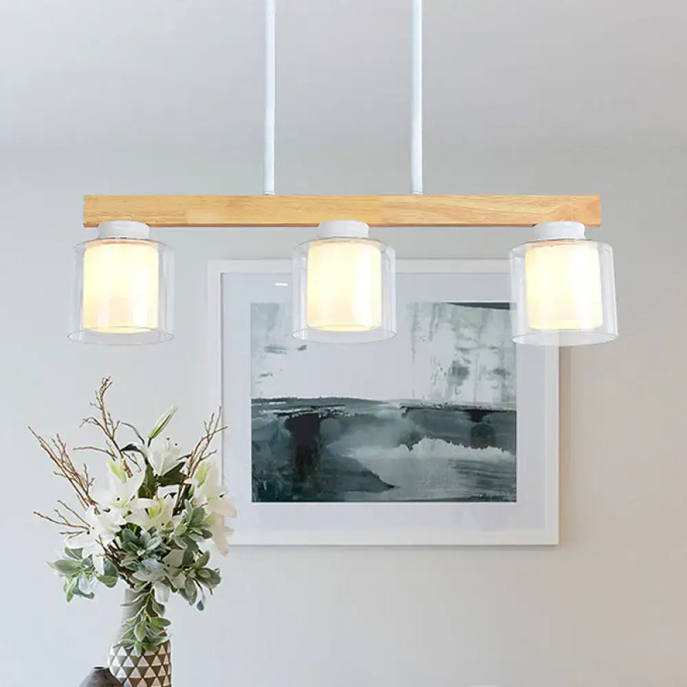 Modern minimalist wood and white glass pendant light with three heads for dining room illumination