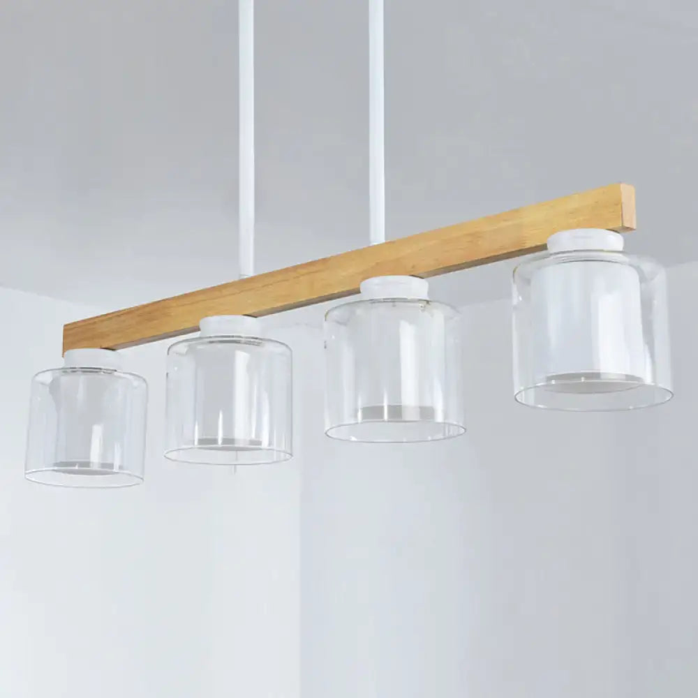 Modern minimalist wood pendant light with white glass shades featuring four heads for dining room illumination