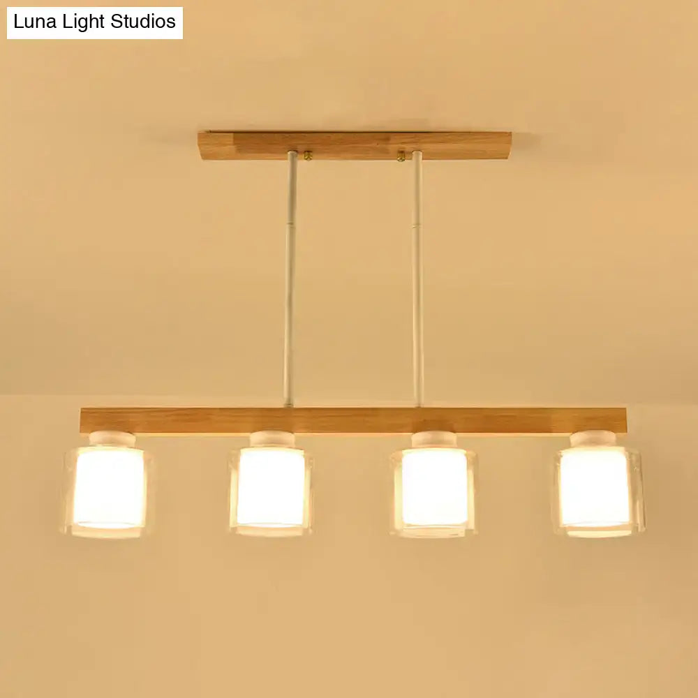 Modern minimalist wood and white glass pendant light with natural wood frame and clear glass shades for dining room heads