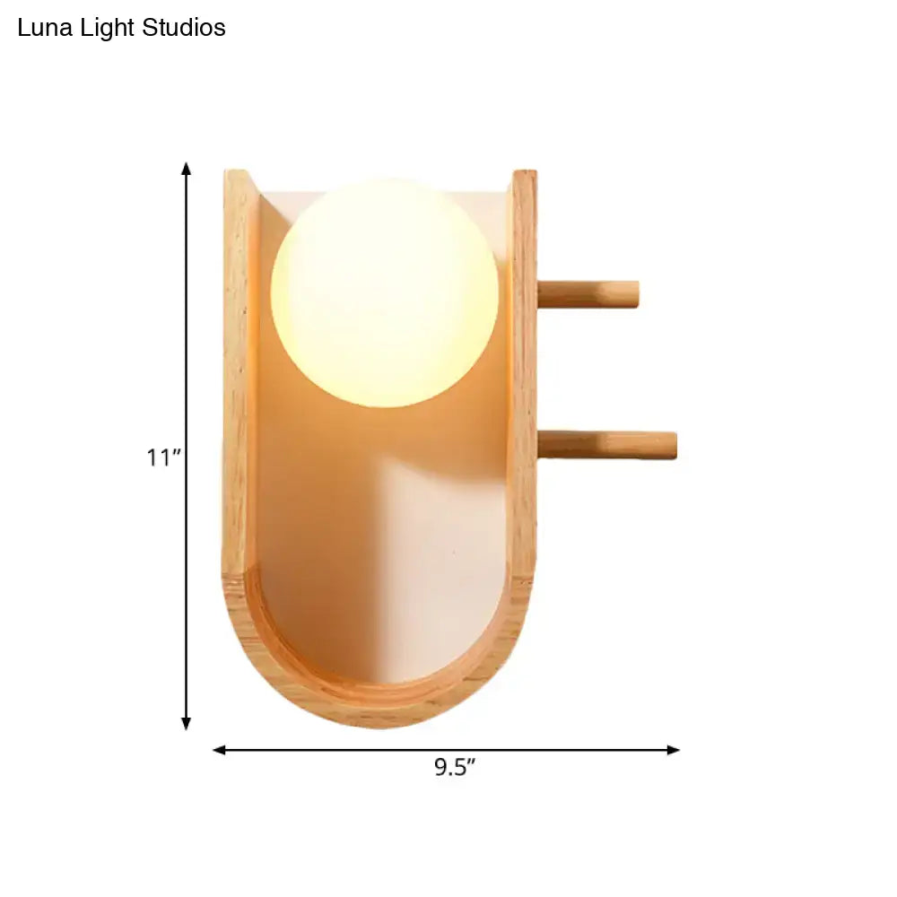 Modern minimalist wooden sconce light with warm glowing half oblong bulb and bamboo accents for bedroom wall light