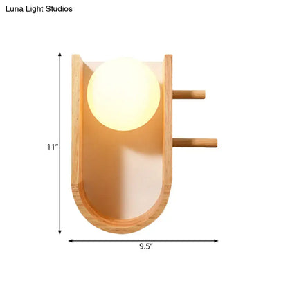 Modern minimalist wooden sconce light with warm glowing half oblong bulb and bamboo accents for bedroom wall light