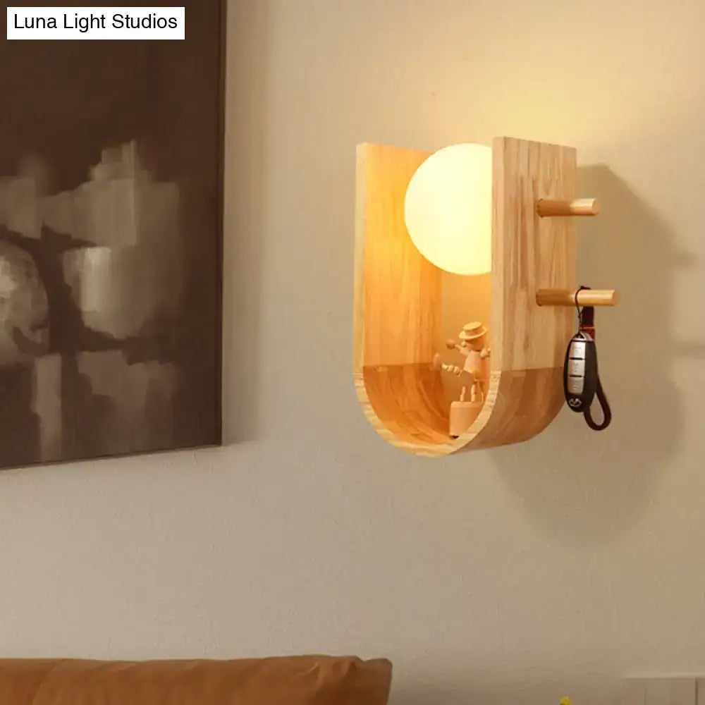 Modern minimalist warm-toned wooden sconce light with half oblong curved design and integrated key hooks for bedroom wall light
