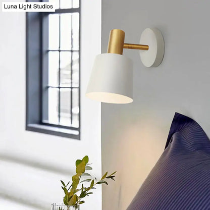 Modern wall mounted lamp with white matte finish and gold metal accents featuring a metal drum sconce design