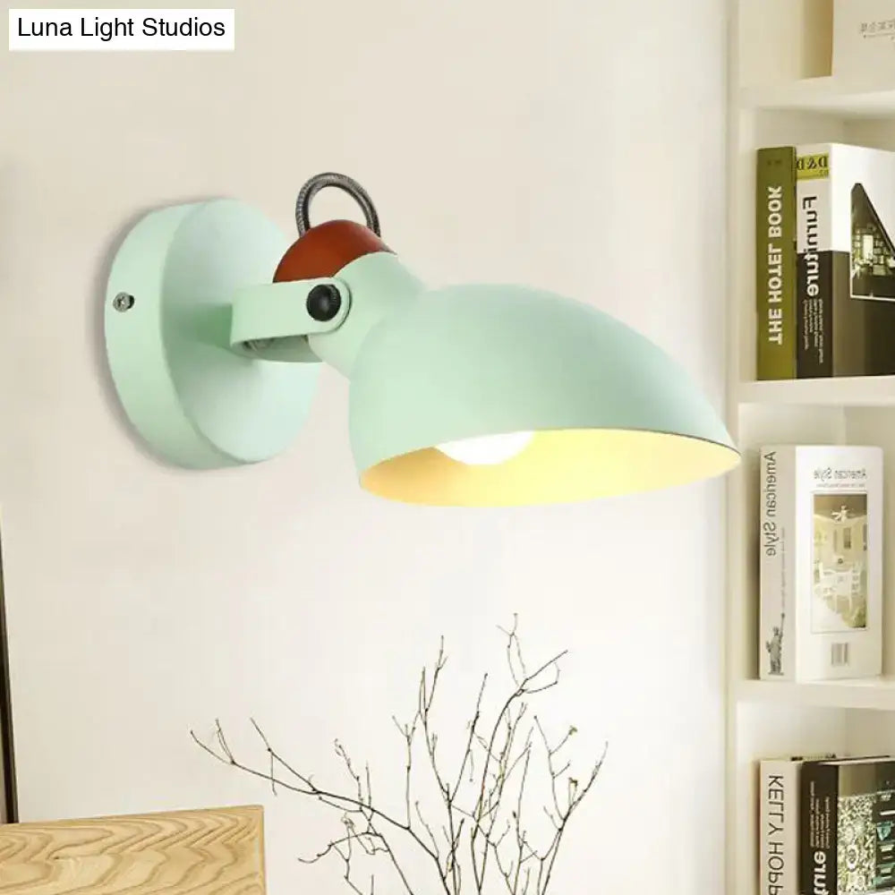 Modern mint green and red wall mounted sconce light with matte finish and warm brown wooden accent for bedroom use