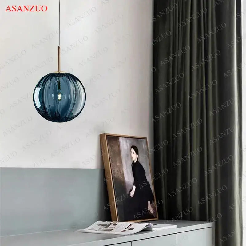 Modern multi color decorbites glass ball pendant lamp with blue glass globe and brass finished hanging rod for dining room decor