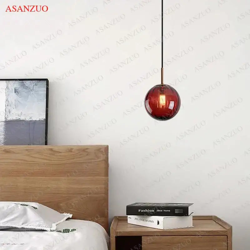 A sleek amber glass ball pendant lamp with minimalist brass fixture from decorbites glass ball dining room set