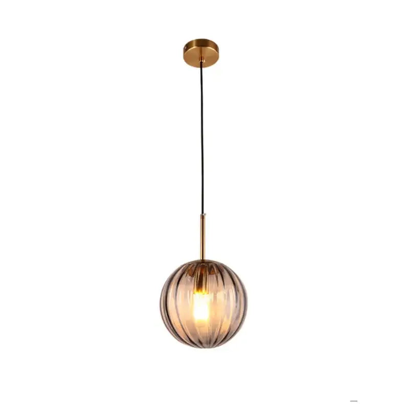Modern multi color glass ball pendant lamp featuring a spherical amber decorbites glass ball pendant with vertical ridges