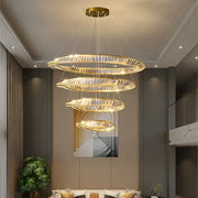 Modern multi tier gold decorbites crystal led chandelier with cascading rings and clear crystal facets for dining room